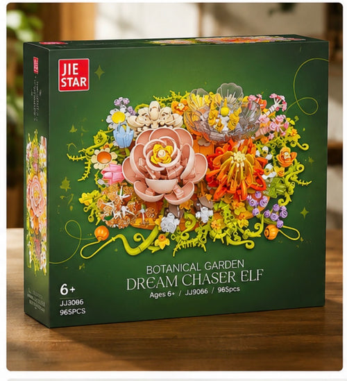 JIE STAR Botanical Garden Dream Chaser Elf building kit box, featuring a dark green background with a colorful 3D floral illustration on the front, set on a wooden surface.